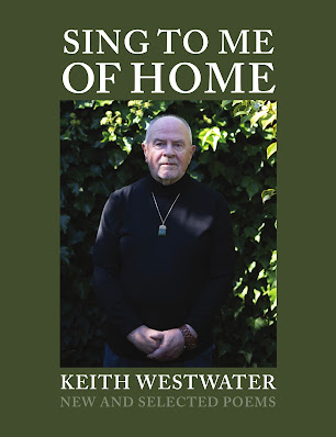 Image shows cover of Sing to me of Home: New and Selected Poems, by Keith Westwater. The book title and author name are in white text on an olive background, with the cover also showing a photo of the author, wearing black, against a background of foliage.